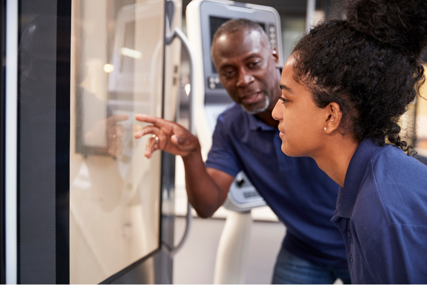 Young engineer receiving feedback from her supervisor